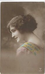 GLAMOROUS YOUNG WOMAN  (REAL PHOTOGRAPHIC COLOURED POSTCARD) 1910