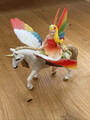 Schleich 70576 Geflügeltes Regenbogeneinhorn, inkl. Reiterin