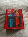 Nintendo Switch OLED Modell - 64 GB - schwarz/rot/blau + Spiel & Zubehör