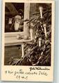 10713327 - Blick durch das Fenster geschmueckter Tannenbaum Weihnachtsmann 1941