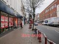 FOTO VICTORIA ROAD SURBITON KLEIDUNGSSHOP HANDY SHOP CHARITY SHOP SCHUHE S