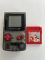 Gameboy Color GBC Game Boy Grau Transparent mit roten Knöpfe  und Pokémon Rot