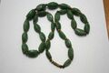 A green jade necklace with brass beads from the 1960s.