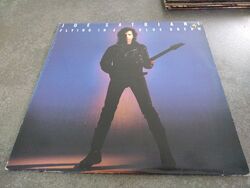 joe satriani - Flying in a Blue Dream. LP. Relativity Records. Ex/VG Promo Punch